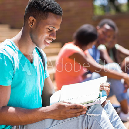 student-reading-text-book