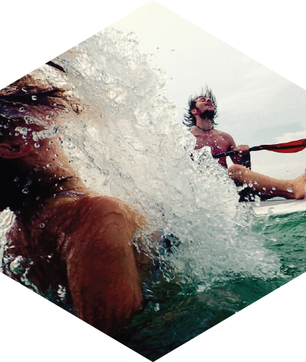 2 people enjoying a swim in the ocean