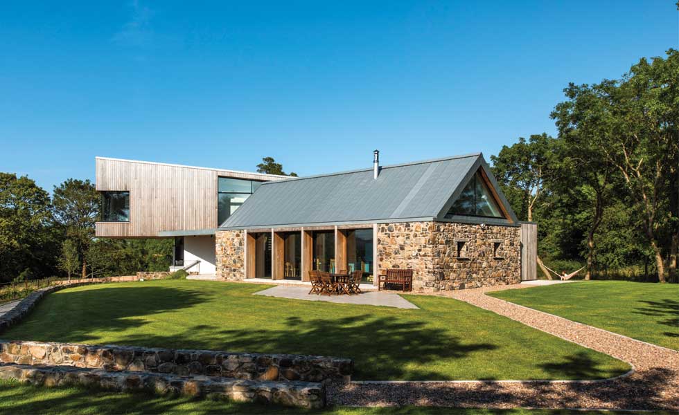 cantilever timber clad extension attached to barn