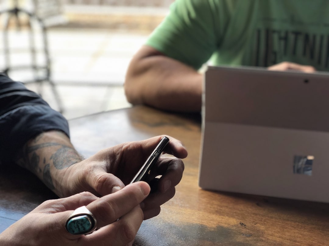 Coworkers using mobile devices
