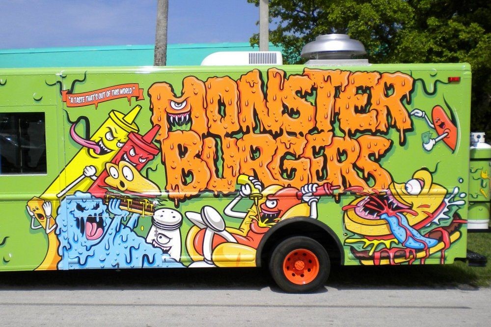 A bus with graffiti on itDescription automatically generated with low confidence