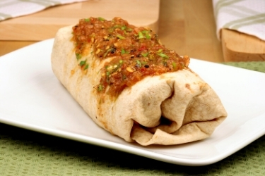 Large burrito with salsa on top