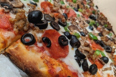 Close up of a combination pizza