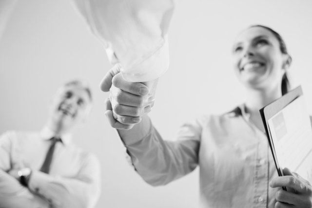 woman shaking hand