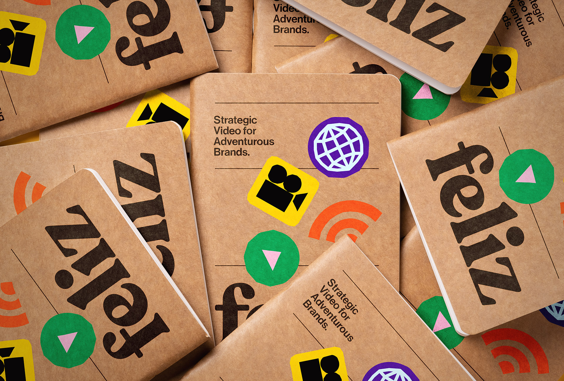 Pile of Feliz branded notebooks