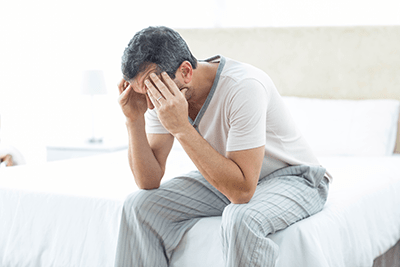 Man suffering with early signs of an enlarged prostate