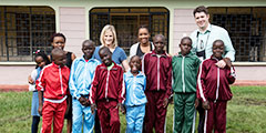 Boys and staff of RICC in front of home