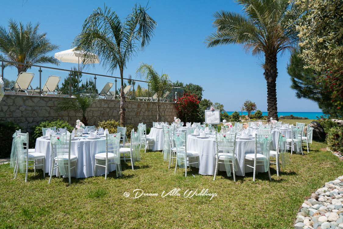 wedding reception tables and chairs on the lawn