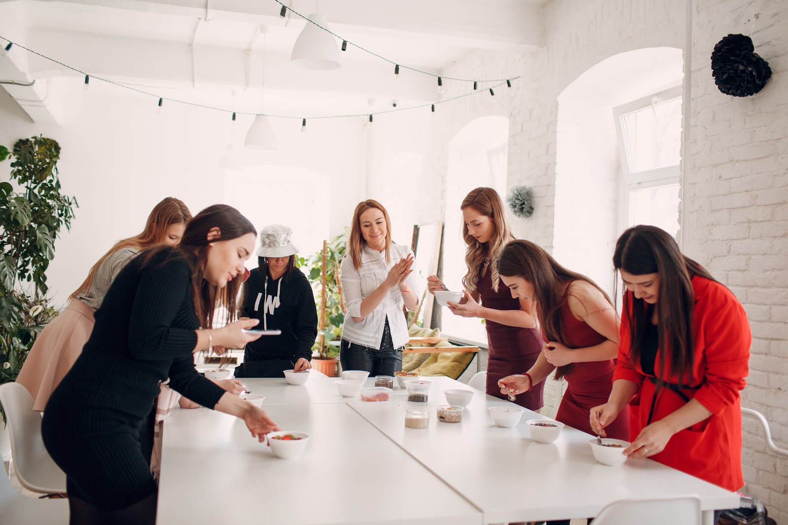 Group of women gathered around a table doin