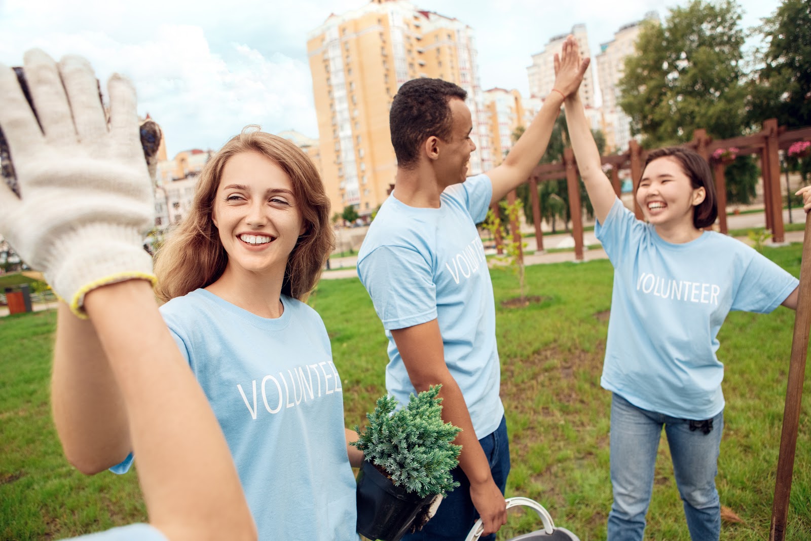 Volunteers high-fiving each other