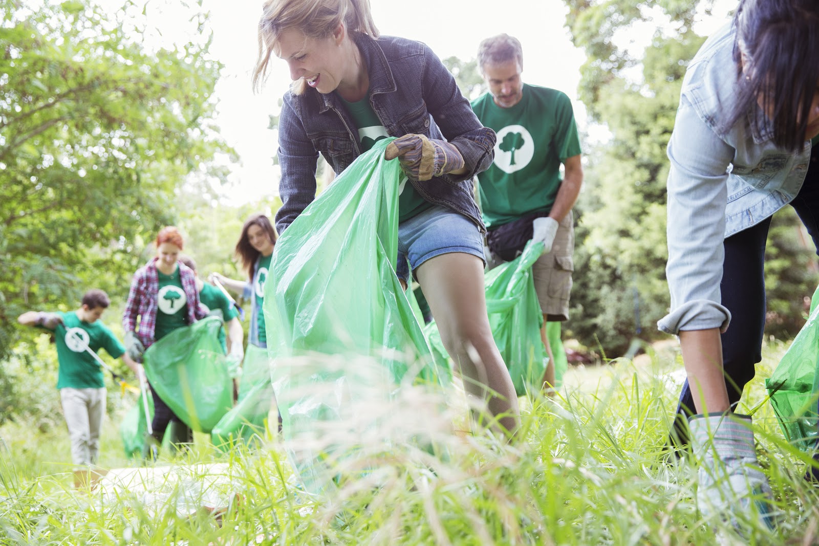 giving tuesday ideas: woman helping with a clean up