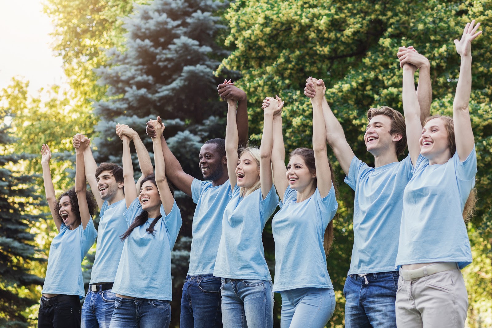 giving tuesday ideas: volunteers raising their hands