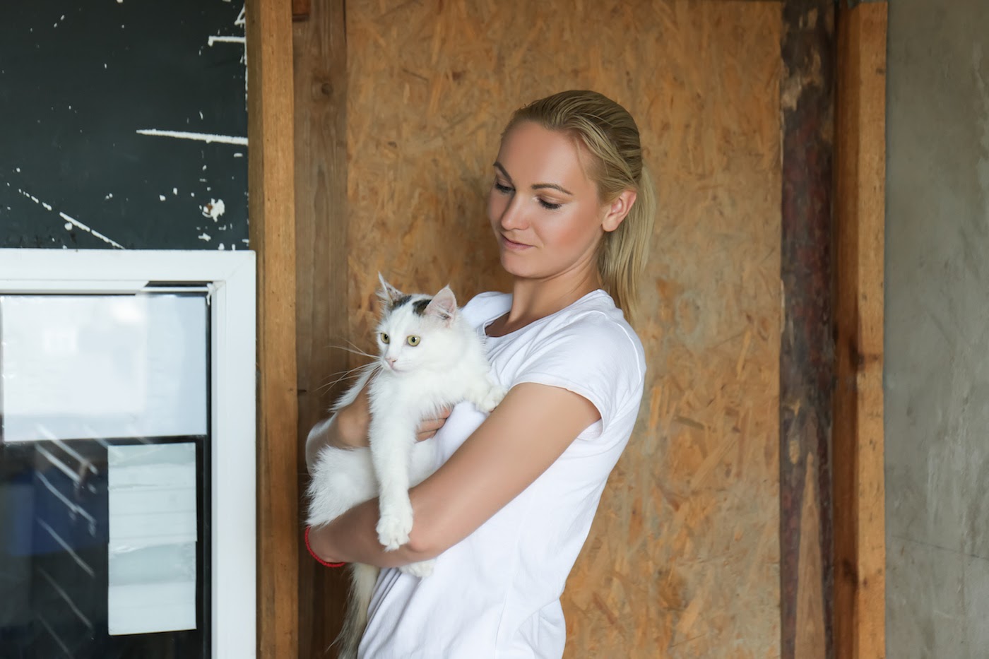 fundraising ideas for animal shelters: Woman holding a cat