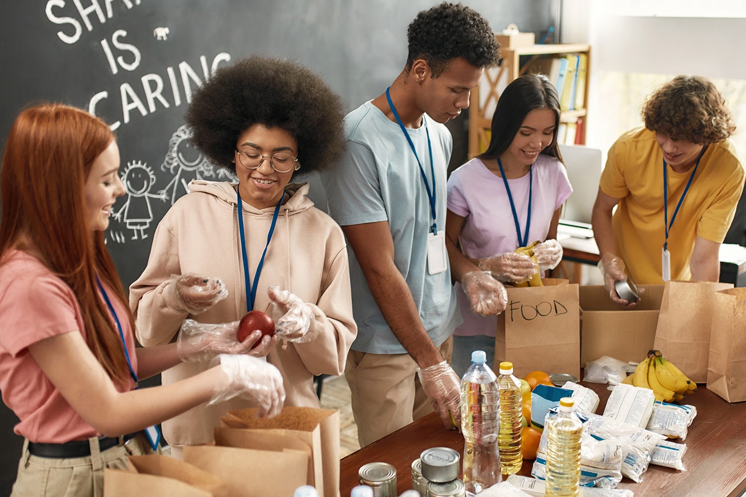 GoFundMe charity: Group of young people sorting food in paper bags