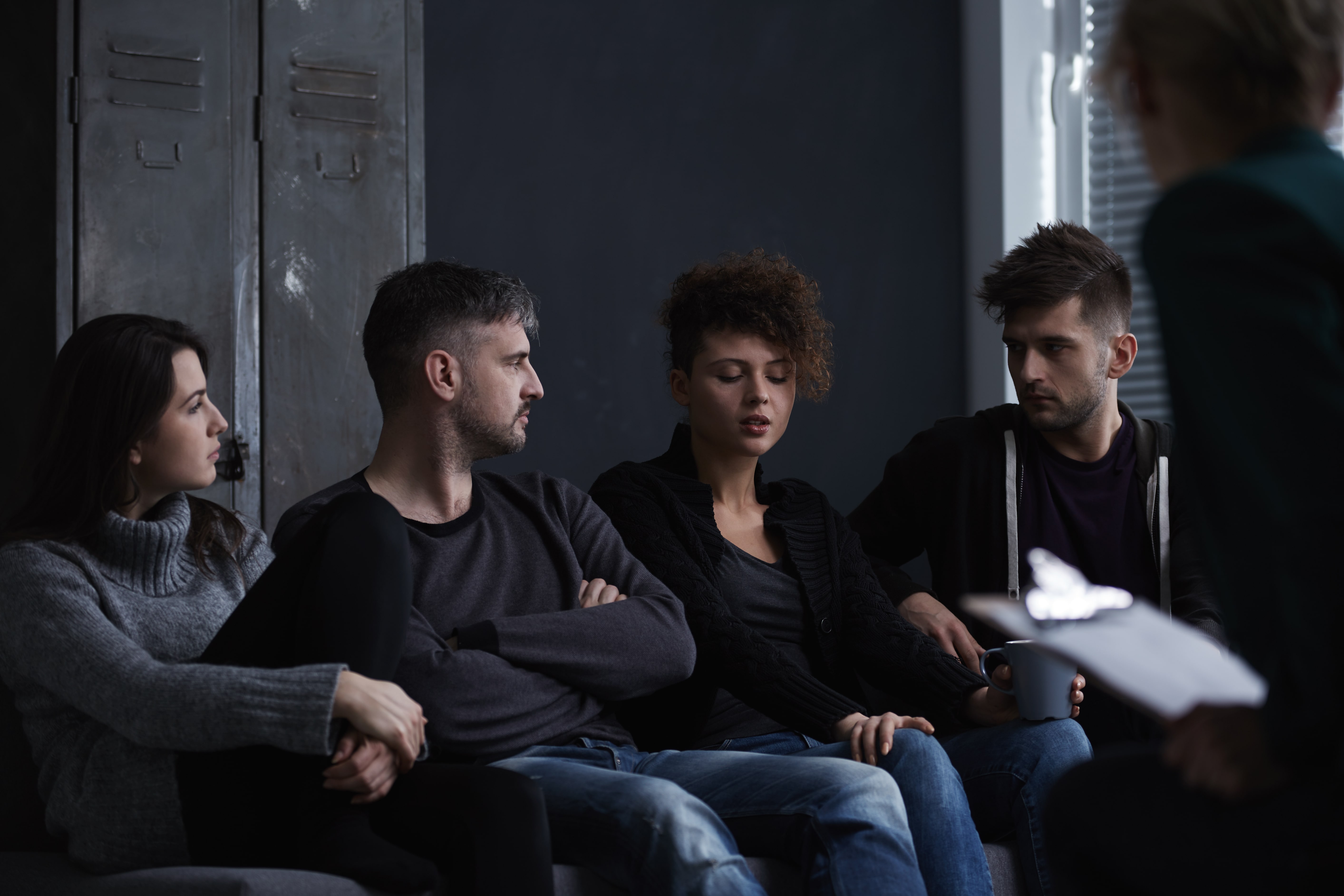 group of people discussing rehabilitation