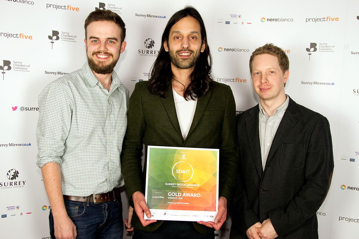 Watb team receiving an award
