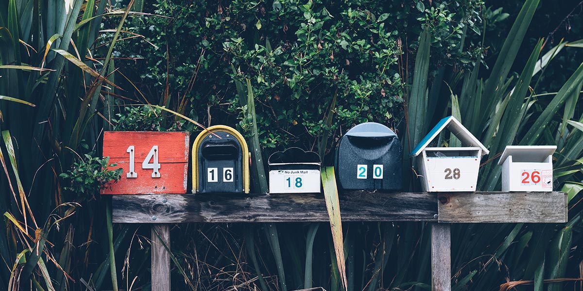 An assorted group of American style, numbered mail boxes
