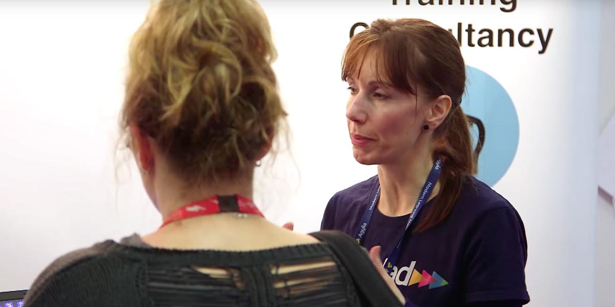 People discussing a business at an exhibition