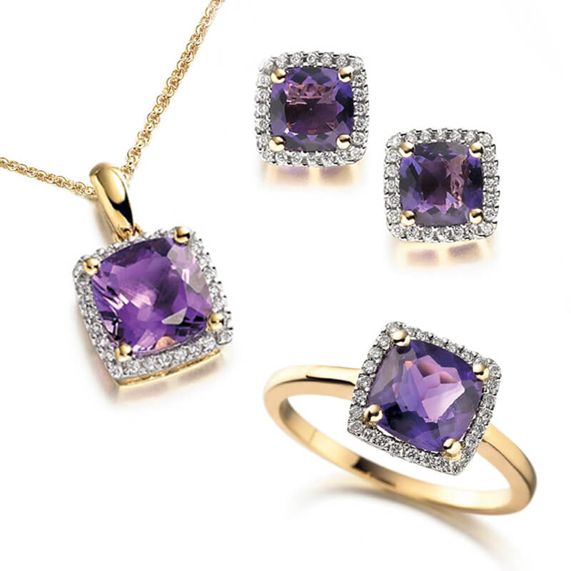 Jewellery suite of pendant, earrings and ring in yellow gold with gemstones