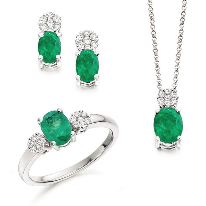 Jewellery suite of pendant, earrings and ring in white gold with gemstones