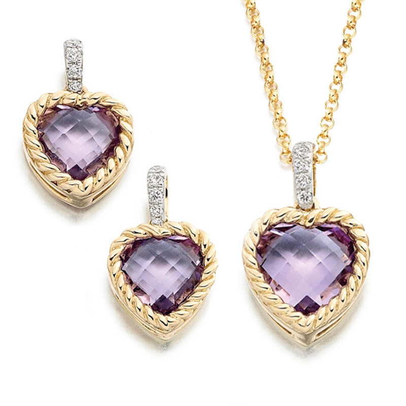 Jewellery suite of pendant and earrings in yellow gold with gemstones
