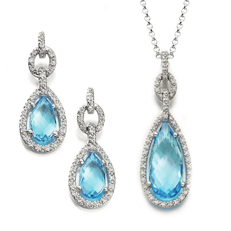 Jewellery suite of pendant and earrings in white gold with gemstones