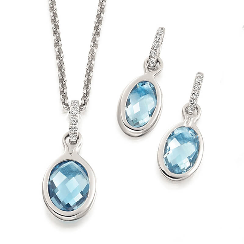 Jewellery suite of pendant and earrings in white gold with gemstones