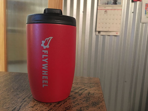 Thermos with the Flywheel logo printed on it