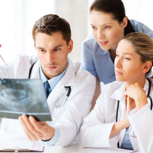 dentists observing teeth xray