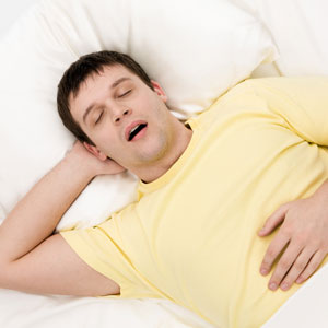 man snoring with sleep apnoea