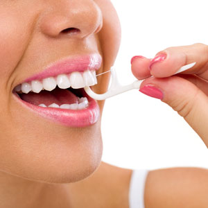 preventative oral health lady flossing teeth