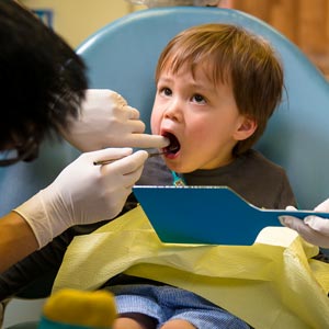 child being attended to by Hawthorn Dentist