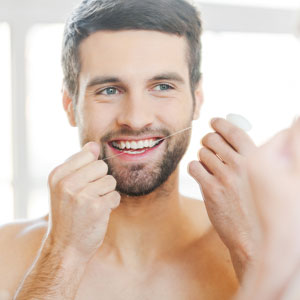 preventing gum disease with flossing