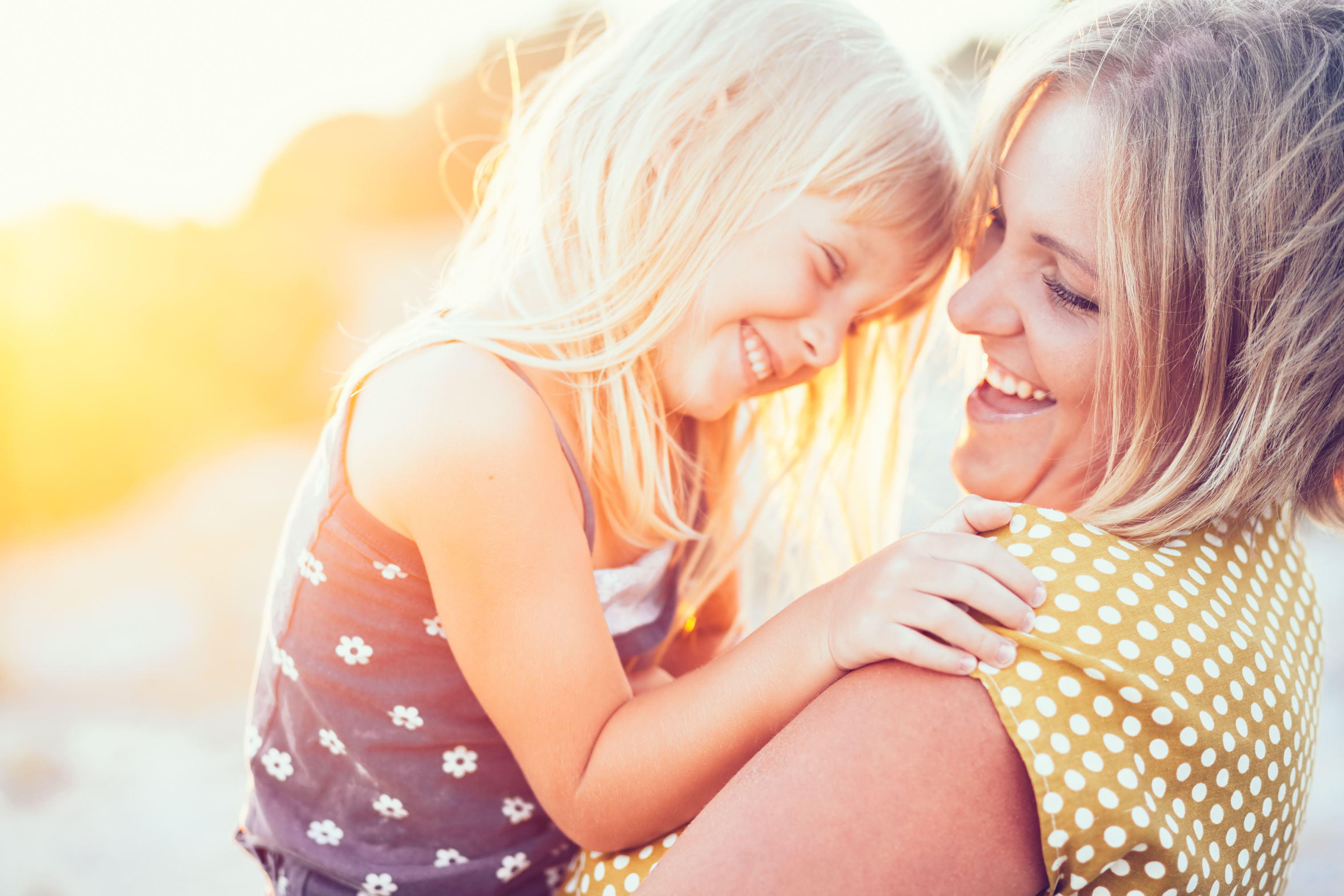 Mother and daughter smiling