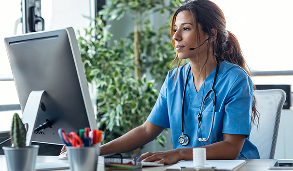 per diem nurse at computer ensuring efficient orientation processes