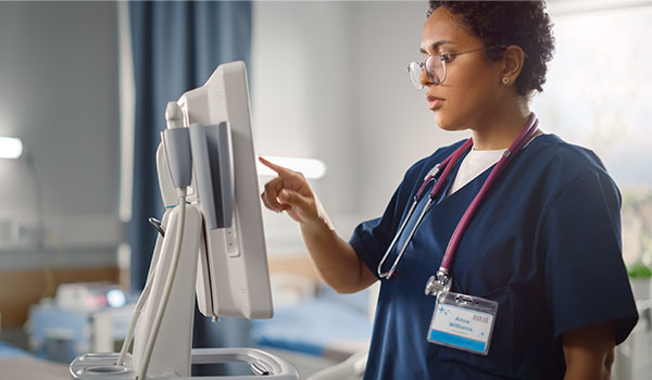healthcare professional reading screen