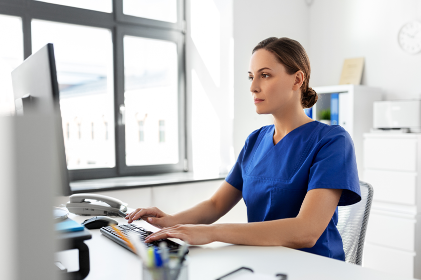 CareRev nurse cross-training while working on a computer