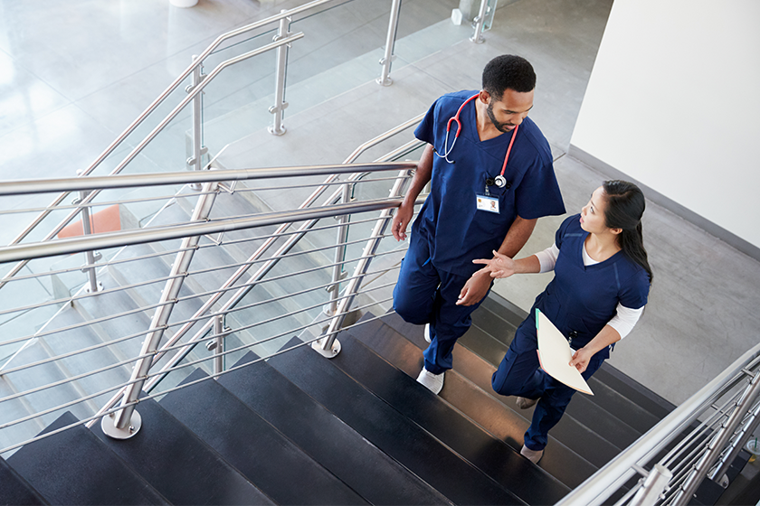 nurses walking up stairs and talking about DEIB efforts