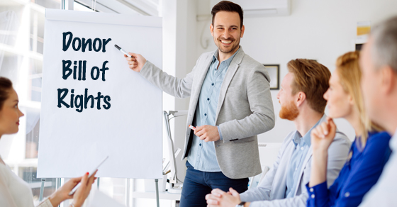 man standing at easel with Donor Bill of Rights