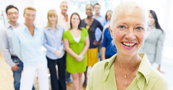 senior woman with group of people in background
