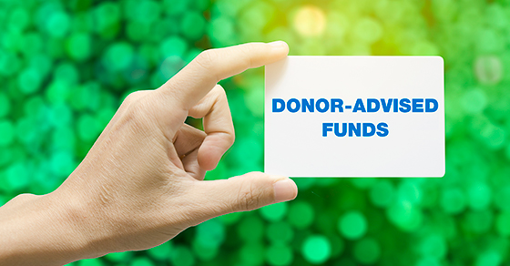 hand holding card that reads DONOR-ADVISED FUNDS