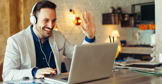 Man on laptop on virtual meeting