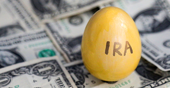 yellow egg reading IRA on dollar bills