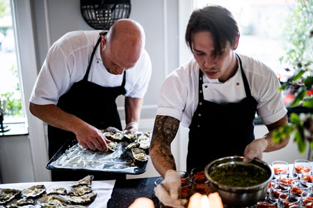 two men working in kitchen
