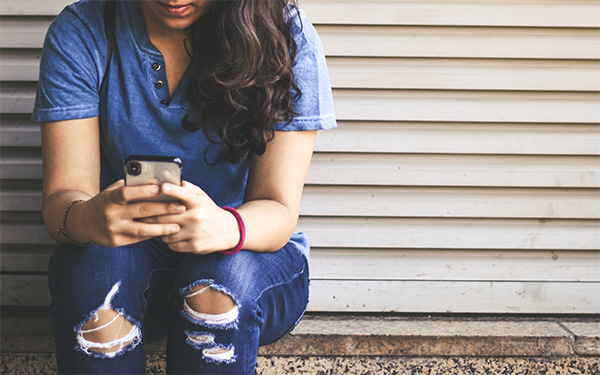 woman texting on phone
