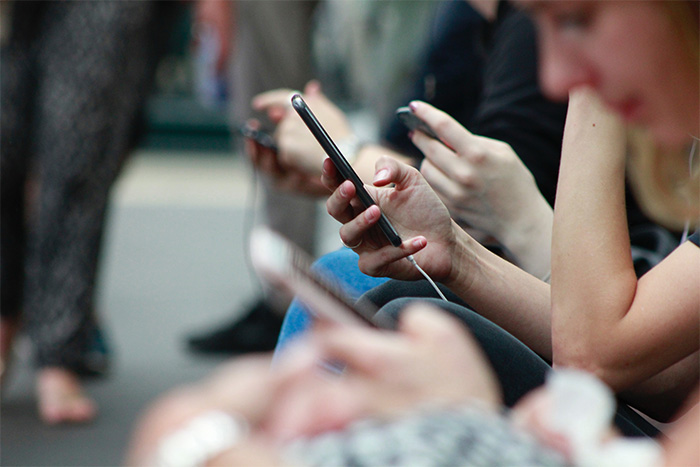 person texting on smartphone