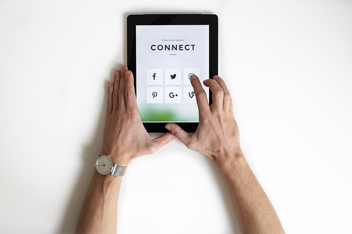 iPad with social media icons