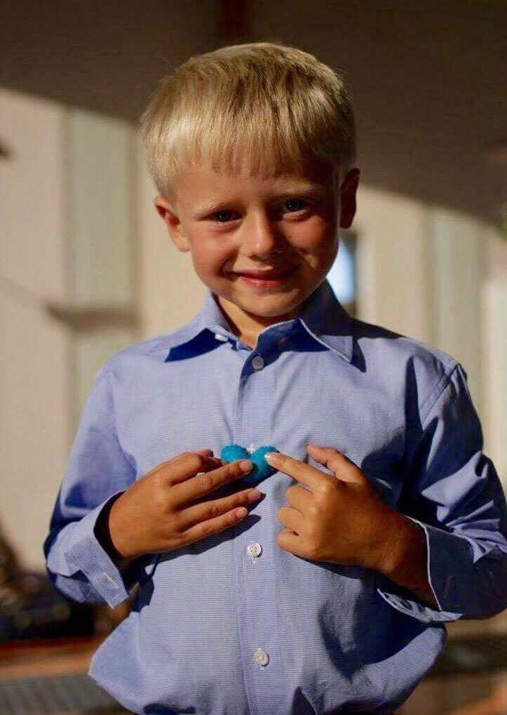 boy holding heart