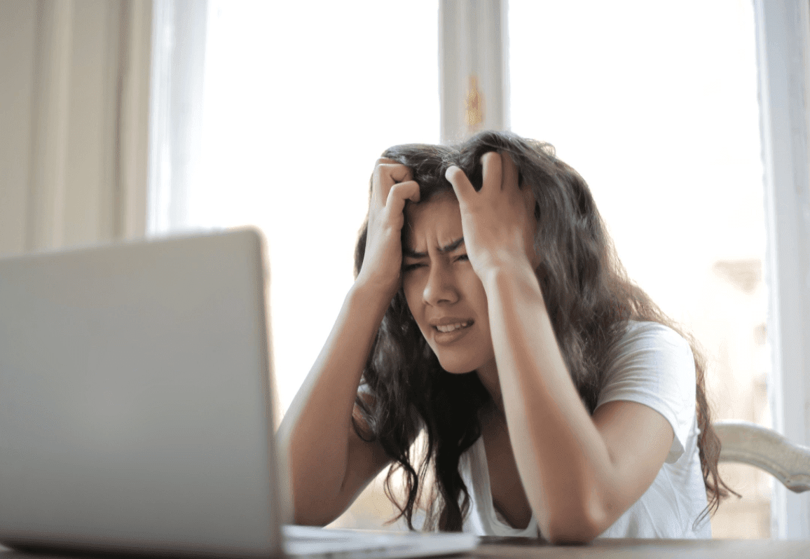 stressed woman with a computer