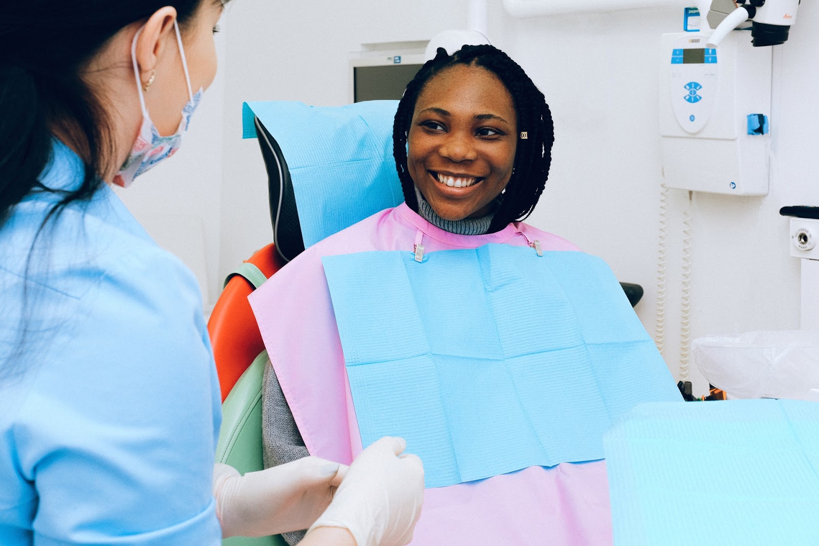 female patient smiling at dentist